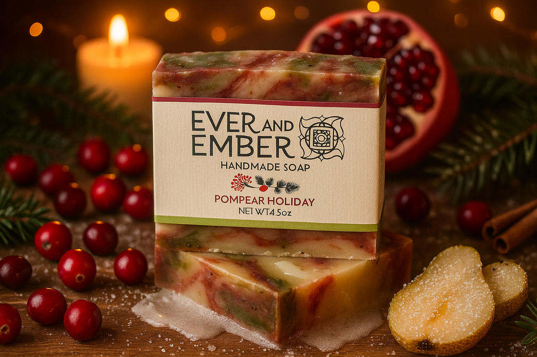 Pompear Holiday Natural Soap Bar surrounded by cranberries, pomegranate seeds, and sugared pears with warm holiday lights and a dusting of snow — a festive, handcrafted flat-lay from Ever & Ember.